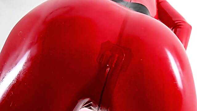 Hot blonde masturbates in latex and stockings with a dildo