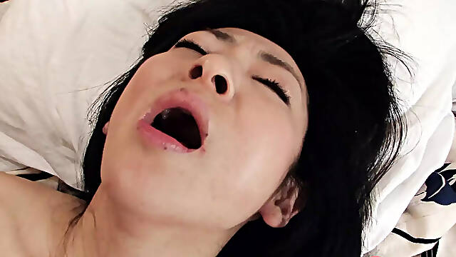 Japanese brunette Milf Emiko Koike blows her husband's hard cock uncensored.