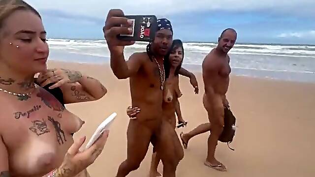 Friends go to the nude beach to give it to the hot guys.