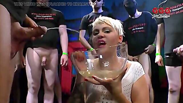 Tattooed Slut Gulps Piss and Cocks in Extreme Ggg Bukkake