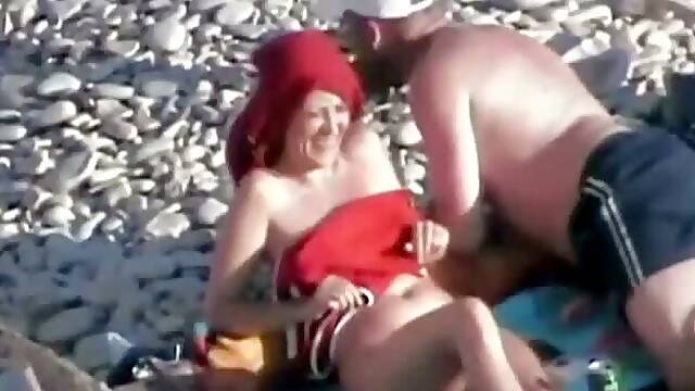 Spooning position on the beach (aunt and lover)