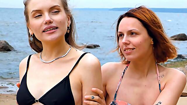 Two hot lesbians have a hot lesbian sex on the beach in bikinis