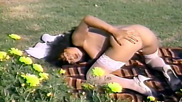 Retro porn video of a brunette chick giving her man a blowjob