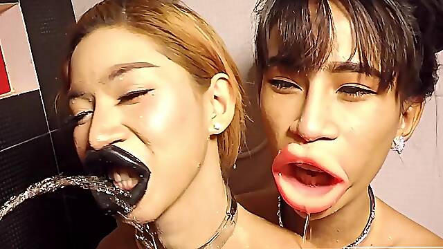 Teen ladyboys both pissed on their big lips and sucking cock together